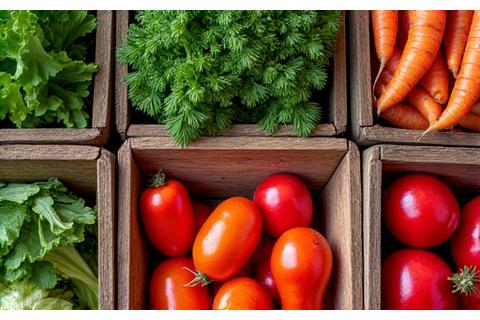 Vibrant, freshly harvested organic vegetables in wooden crates at a farmer's market.